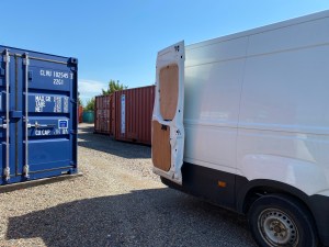 van unloading at a shipping container