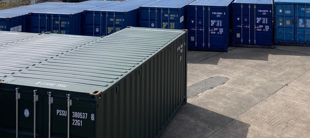 view of shipping containers in storage depot
