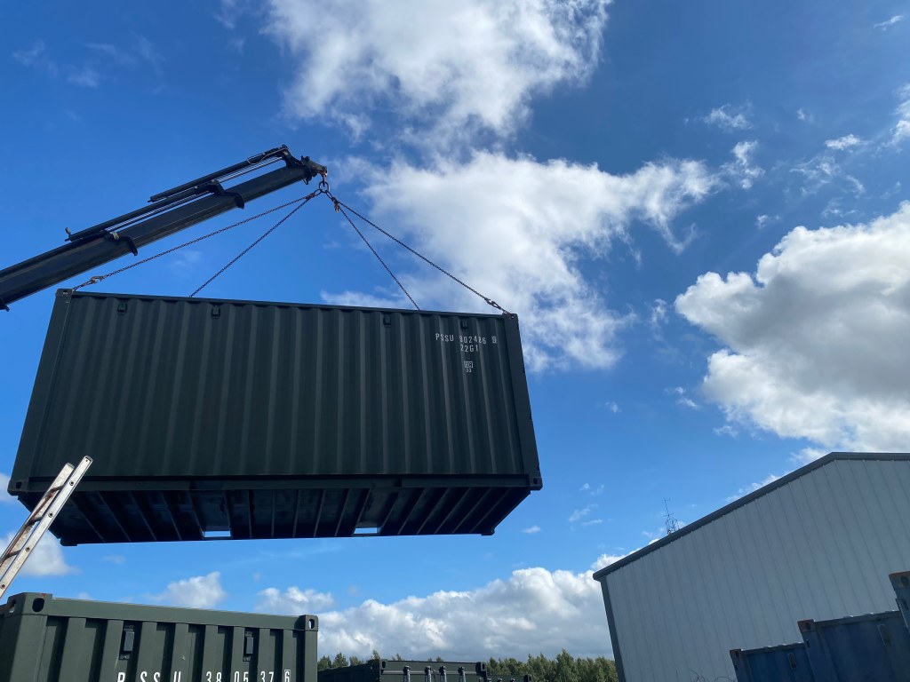 a shipping container in the air being sited