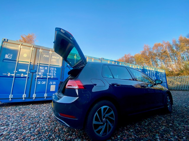 a motor car about to unload household contents into a self storage unit