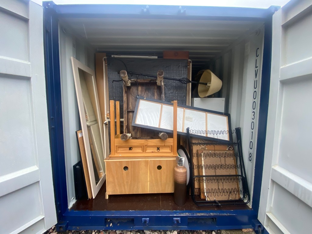 a small container with furniture inside it