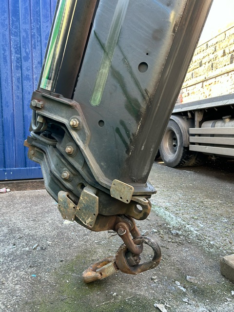 the hydraulic arm of a HIAB with chain attachment