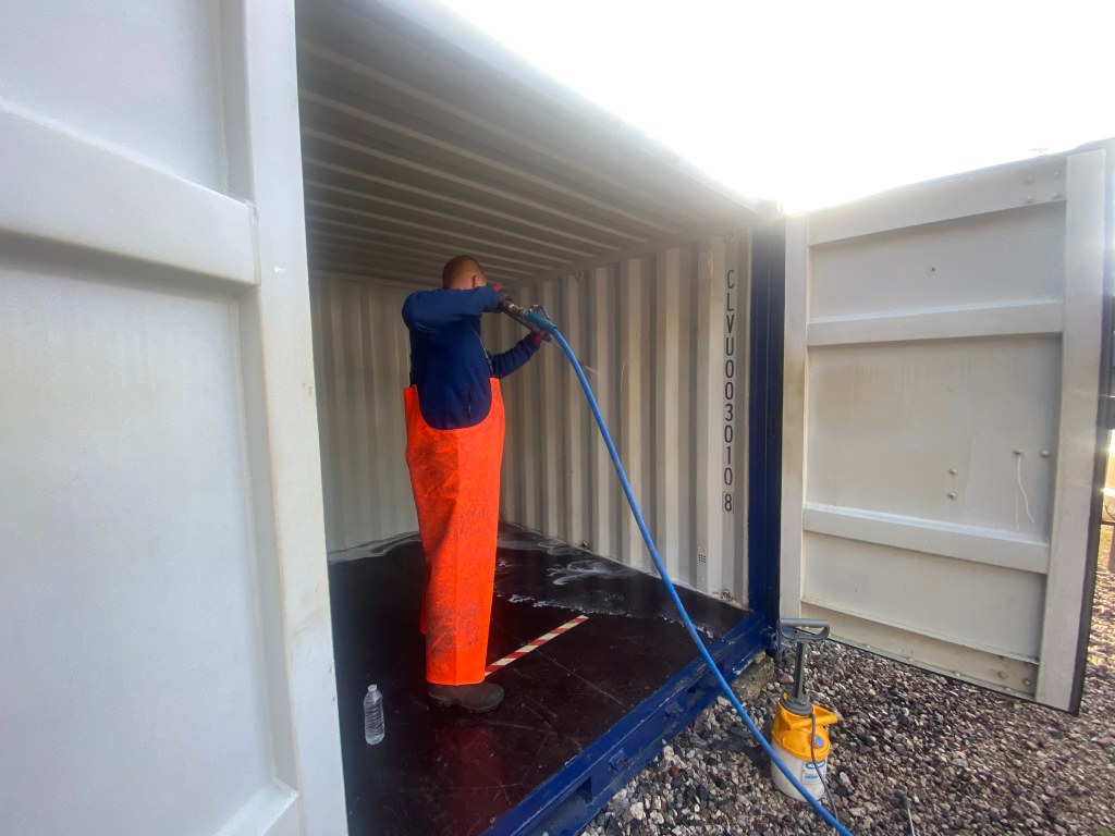 small storage unit being cleaned internally