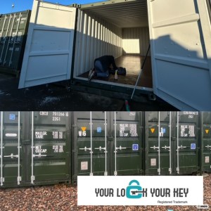 shipping containers in a row with one open