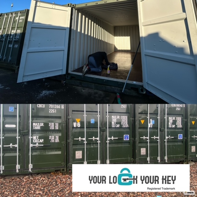 a row of shipping containers with one being cleaned internally