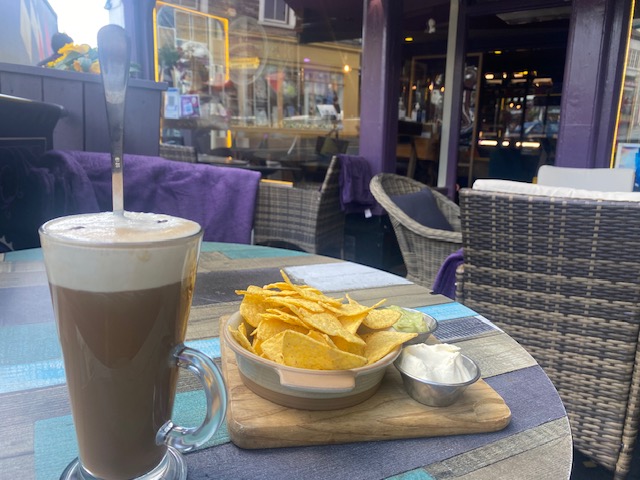 coffee and snack on a table at the Magic Roundabout café premises at Windermere, Cumbria 