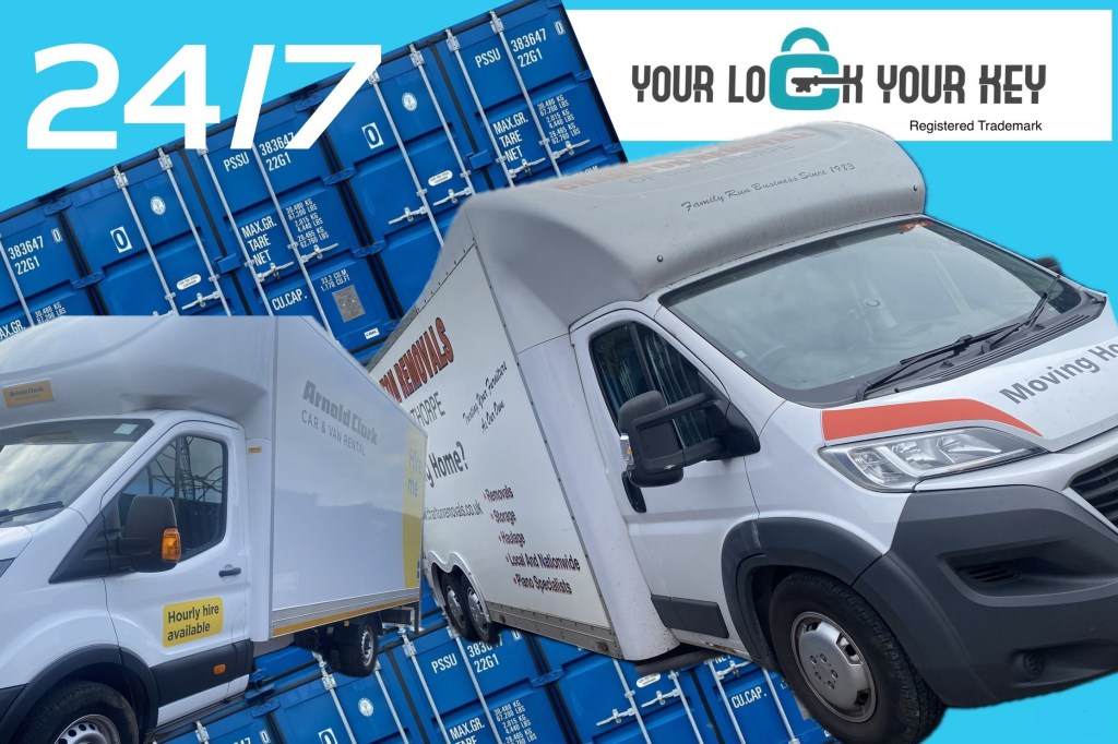 a van next to a row of shipping containers