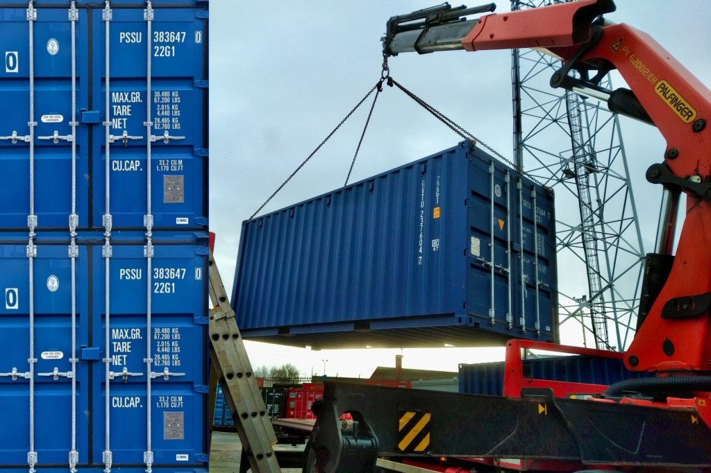 a crane lifting a shipping container