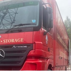 a bright red furniture removals lorry.