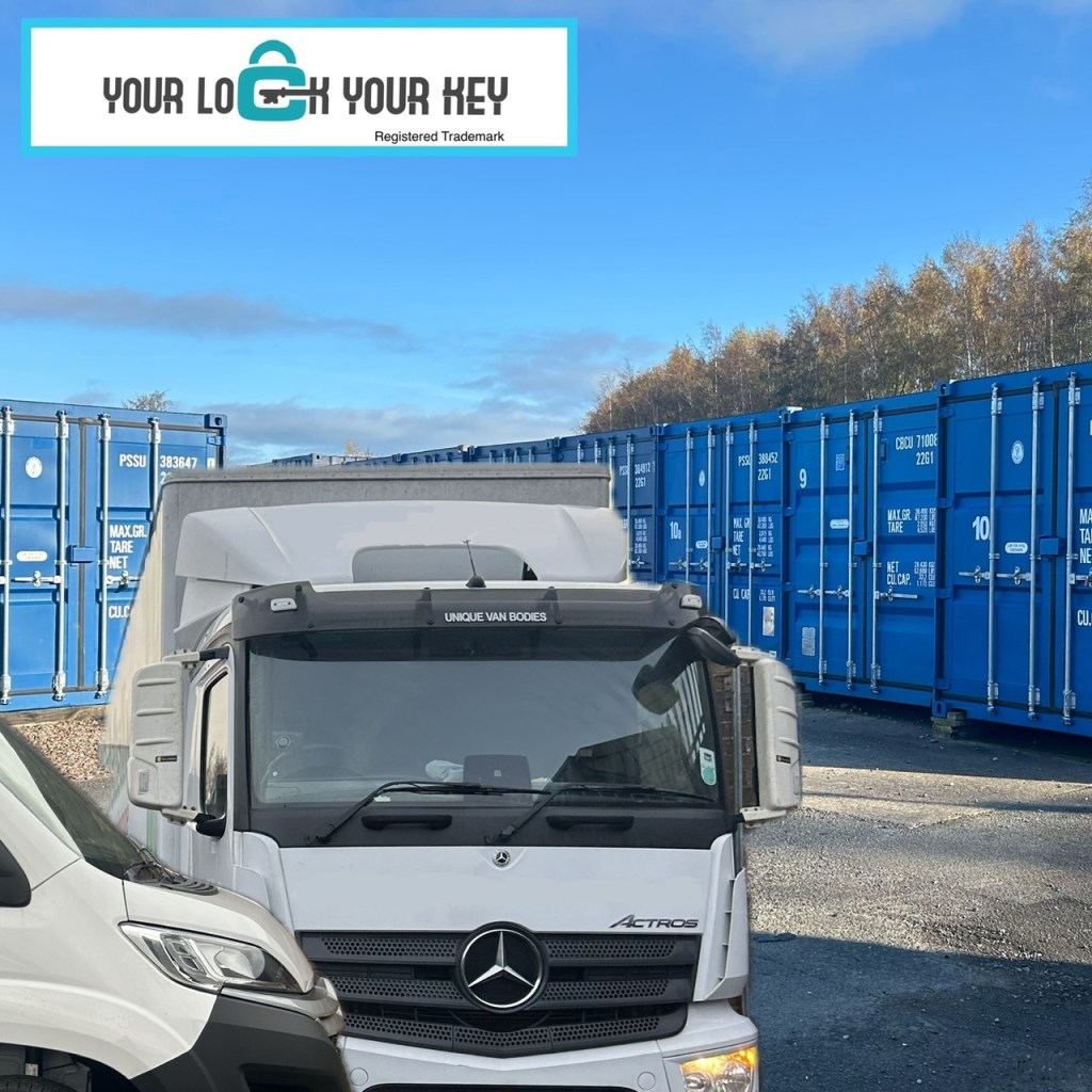 an HGV unloading next to shipping containers