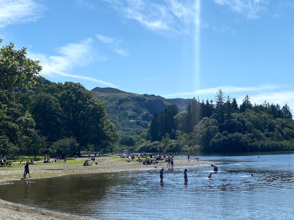 lake scene in Keswick, Cumbria showing people in the Lake enjoying themselves