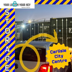 White car infront of shipping containers promoting self storage