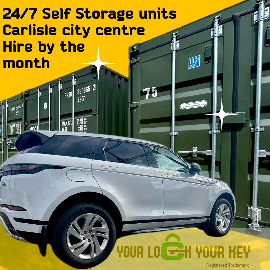 a white 4x4 beside a row of shipping containers