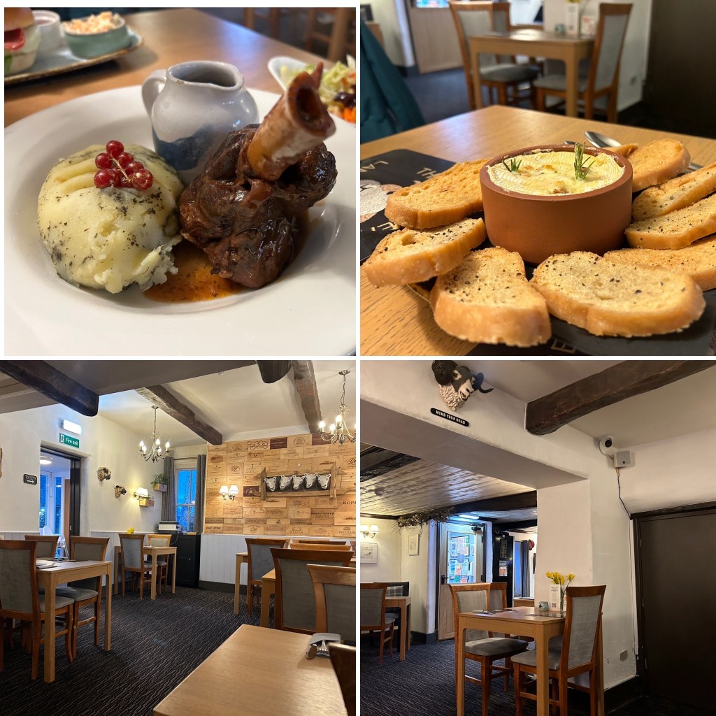 A place to eat in Cumbria featuring a plate of slow-cooked lamb shank with mashed potatoes and a small jug of gravy garnished with redcurrants.