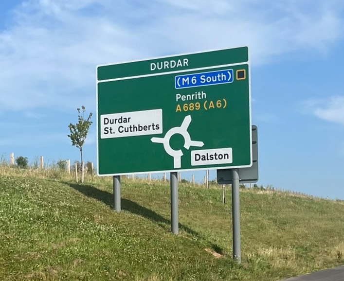 Road sign pointing to M6 and Durdar, Carlisle, Cumbria.