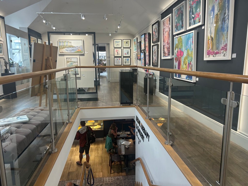 Interior of Treeby and Bolton Café in Keswick, Cumbria showing the interior art gallery and café space.