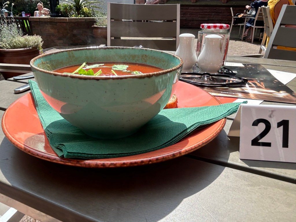 A bowl of tomato soup on a table from Tullie House Museum Café in Carlisle, Cumbria.